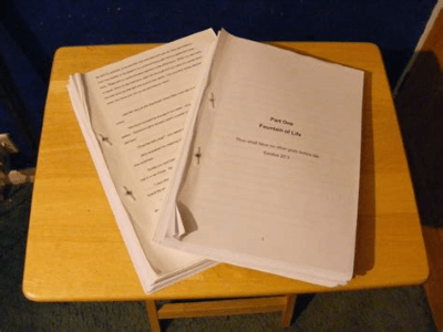 A book manuscript sitting on a desk, ready to be sent to a literary agent.